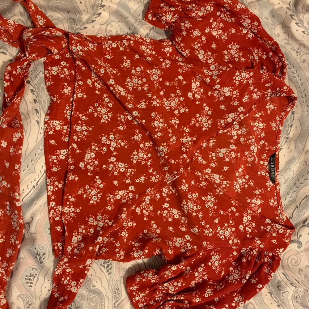 Red tie blouse with flower detailing